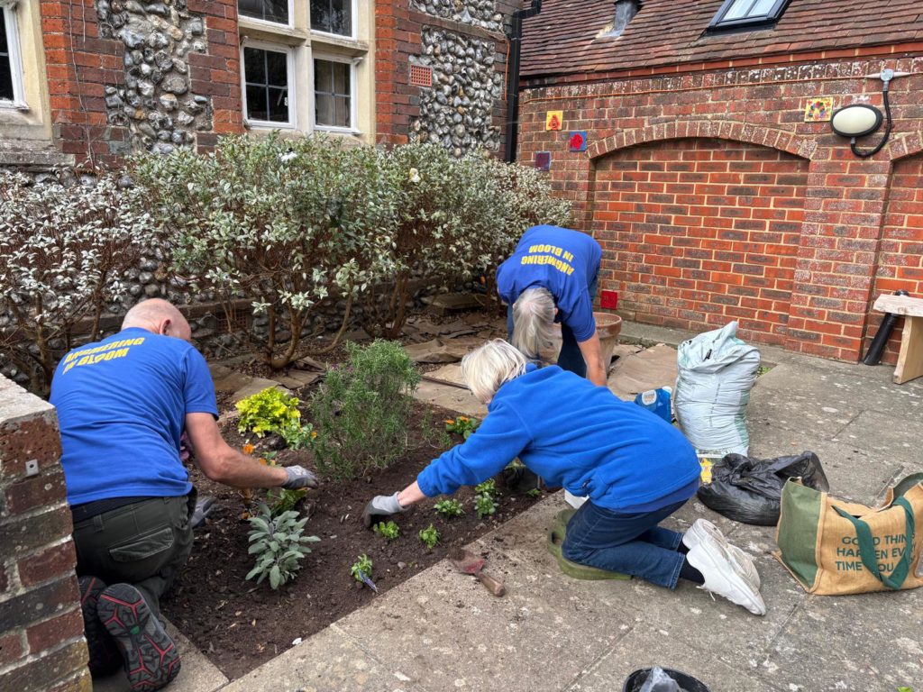 Planting in the Library Garden by Angmering in Bloom